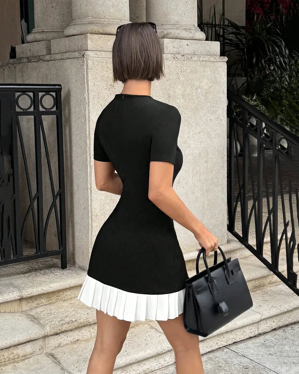 Black Mini Dress with White Pleated Hem