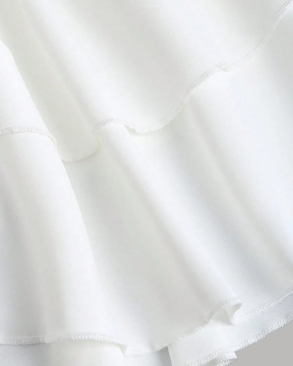 Ruched White Halter Neck Mini Dress with Tiered Layers