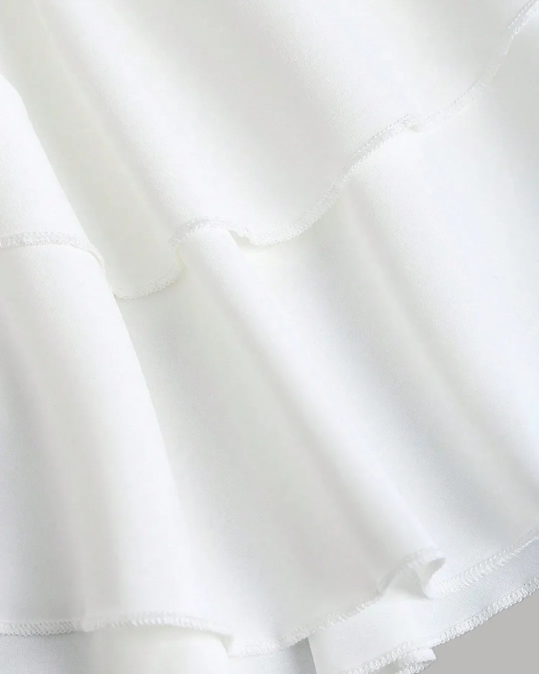 Ruched White Halter Neck Mini Dress with Tiered Layers
