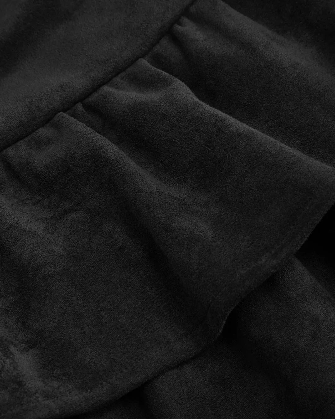 Suede Low Rise Ruched Layered Mini Skirt in Black